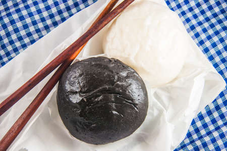 Black and white steamed bun and chopsticksの写真素材