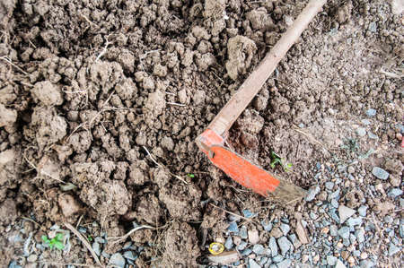 Hoe or digging tool on soilの写真素材