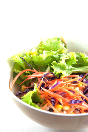 Vegetable salad bowl isolated on whiteの写真素材