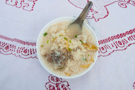 Thai boiled rice with pork for breakfastの写真素材