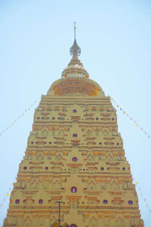 golden pagoda at buddhist temple in Kanchanaburi ,Wangwiwegaram Temple Thailandのeditorial素材