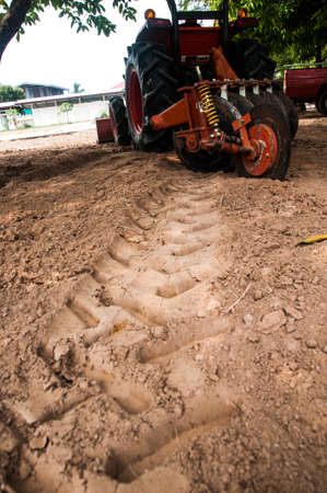 Ploughing heavy tractor during cultivation agriculture worksの写真素材