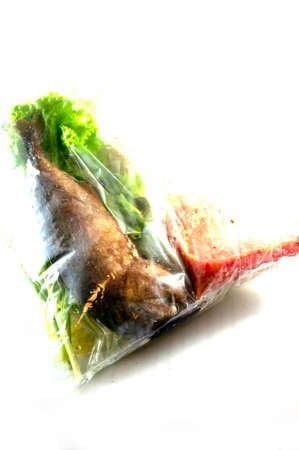 fried mackerel in packaging , thai food.