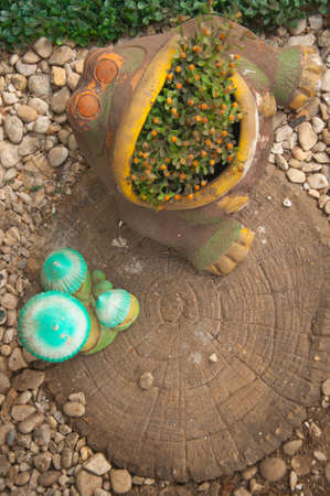 Doll clay pot on tree in gardenの写真素材