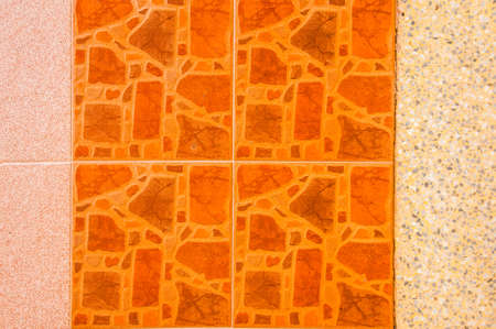 Orange tiles on the wallの写真素材