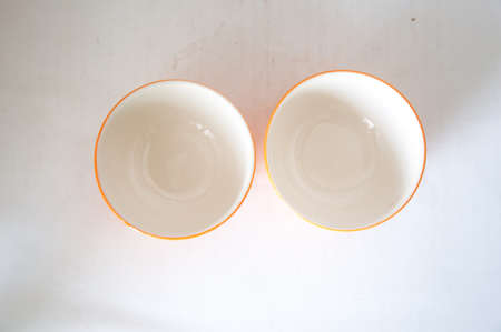 Empty orange ceramic bowlの写真素材