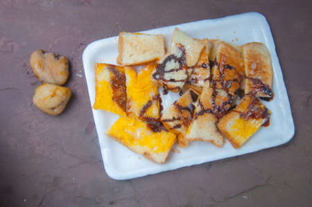 toast topped with milk , butter and chocolateの写真素材