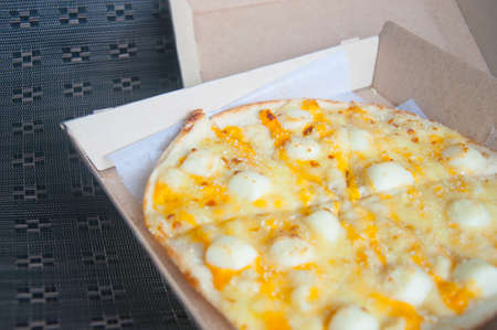 Cheese Pizza Lifted Slice in boxの写真素材