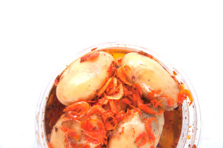 sweet zalacca with chili syrup and dried shrimp in the cup isolate on white backgroundの写真素材