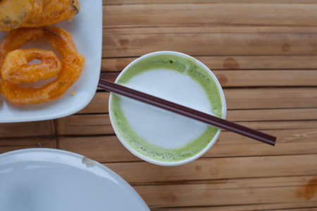 Hot Green Tea Latte,The view from the top on bamboo tableの写真素材