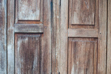 closeup of an ancient wooden door closedの写真素材