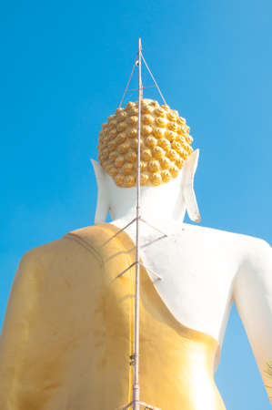 Sitting Buddha in the Temple of Wat Phra That Doi Kham in Chiang Maiの写真素材