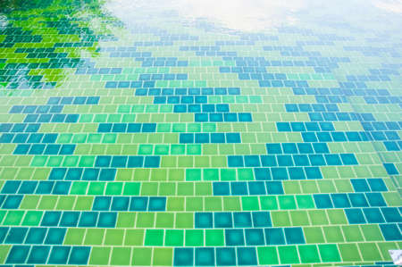 green tile texture background of swimming pool tilesの写真素材