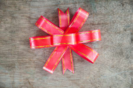 red bow on a rustic boards