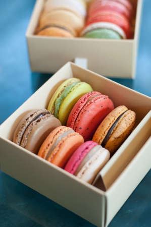 Assortment of different colored macaroons in box