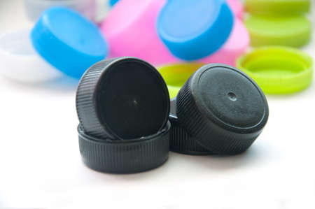 plastic bottle caps on white background
