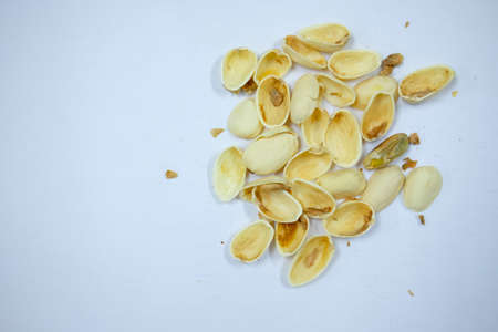 shell pistachios nuts on whiteの写真素材