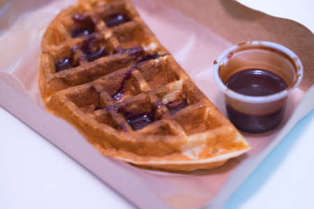 Waffles snack with chocolate sauce in box