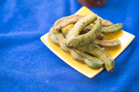 Fresh tamarind on blue table