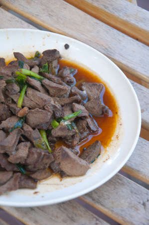 Stir fried pork liver on white plate. Homemade Idea of asian cuisine. Thai foodの写真素材