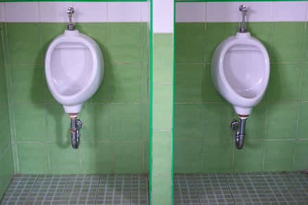 Urinals Men public in green toilet room, wcの写真素材