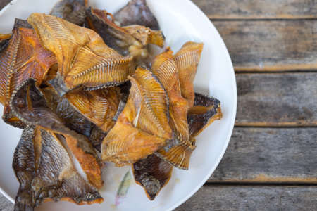 Fish tilapia fried delicious thai food on white dish