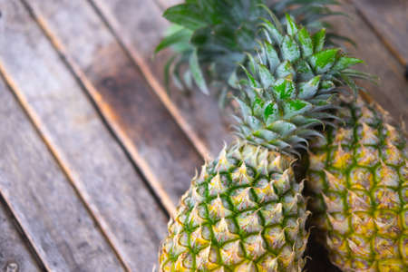 fresh pineapple on wooden background