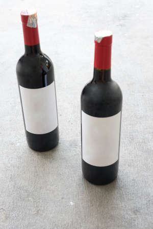 Two red wine bottle, with real paper blank labelの写真素材