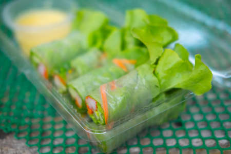 salad rolls in clear plastic boxの写真素材