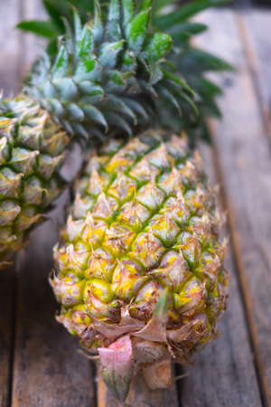 fresh pineapple on wood backgroundの写真素材