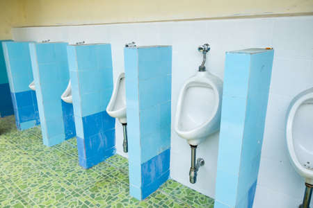 urinals in an old building for men onlyの写真素材