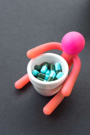 Blue and green capsules, medicine antibioticの写真素材