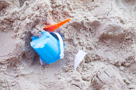 Children's flip flops with beach toys