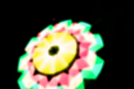 blurred of neon lights decorative in front of Thai templeの写真素材