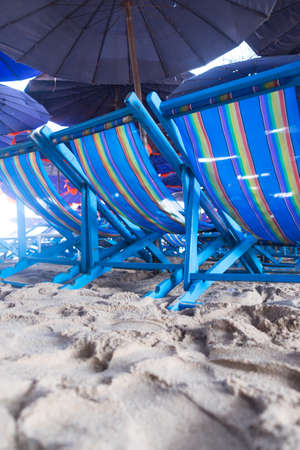 beach blue chairs at Cha-Am beach, Thailandの写真素材
