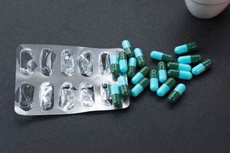 Pharmacy theme, Heap of blue green round capsule pills with medicine antibioticの写真素材