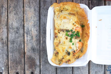Asian cuisine - Omelet with oysters in box