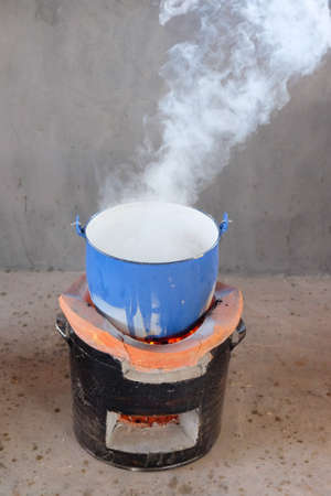 steel pot on clay stove in thai kitchenの写真素材