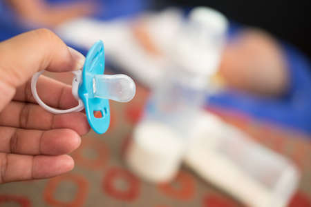 Blue baby silicone pacifier close upの写真素材