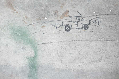 Curly cute little baby drawing with pen color on the wall. Works of childの写真素材