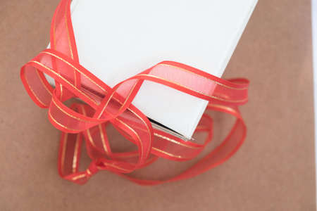 present paper box with red ribbon bowの写真素材