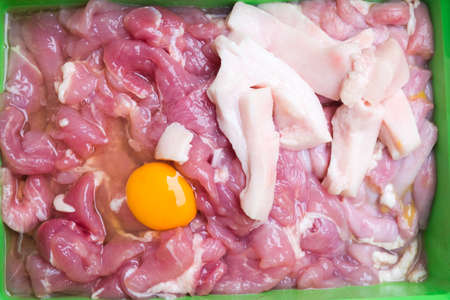 Set of raw several meat with egg yolk for sukiyaki