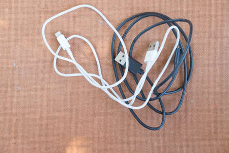 usb cable port charger on wood background