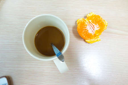 Hot coffee and fresh fruit orange healthy breakfastの写真素材