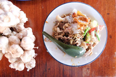 Thai style food on rice in dish zincの写真素材