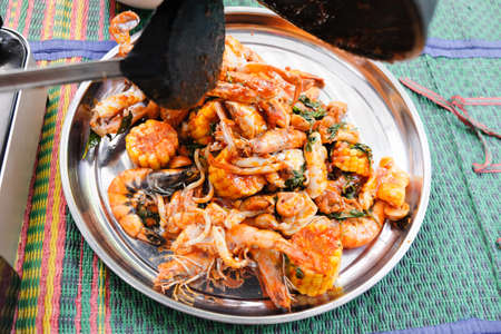 Fried shrimp ,squid and crab with basil with hot and spicy sour, menu enjoy with rice good for...