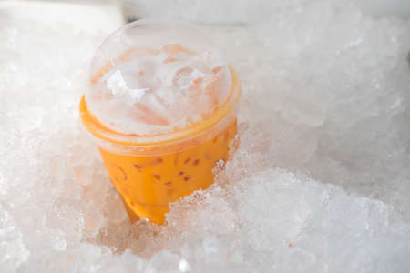 Ice Thai milk tea drink for summer in ice bucketの写真素材