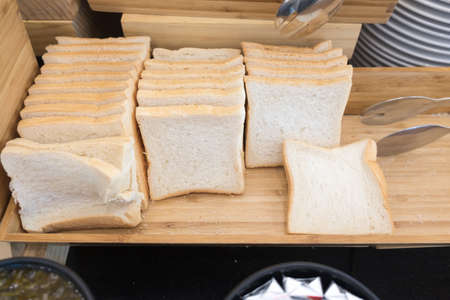 toast bread and slice in wood boxの写真素材