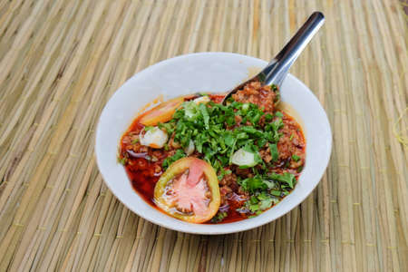 northern Thai meat and tomato spicy dip sauce, usually eat with fresh vegetables. Thai called "nam-prik-ong"の写真素材