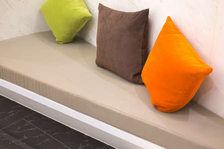 modern living room interior with leather sofa  and colorful pillowの写真素材